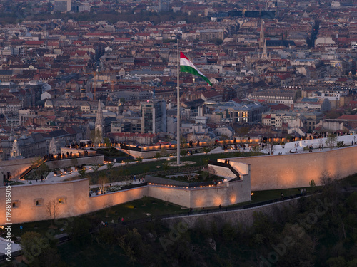 Renovated Liberty Statue, Szabadság Szobor, Citadella visitor center and Hungarian flag on Gellért Hill in Budapest, Hungary.
