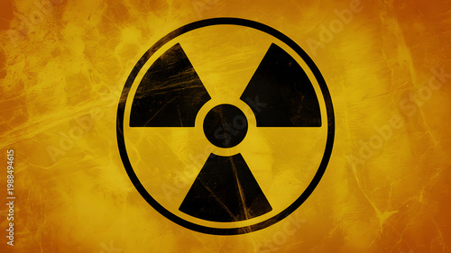 A black radiation symbol on a yellow and orange textured background on transparent background