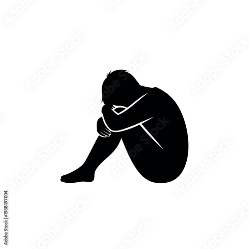 Silhouette of a person curled up in a ball representing sadness and isolation.