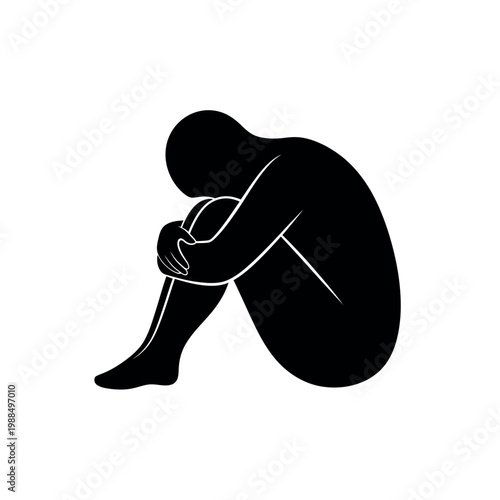 Silhouette of a person curled up in a ball symbolizing sadness and isolation 1.