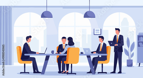 Professionals in a modern office collaborate around a long table, using laptops