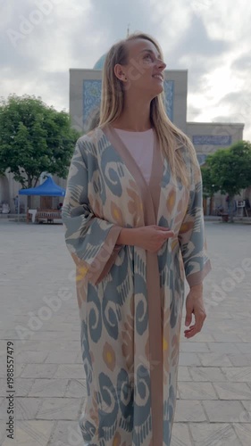 Woman in Uzbek robe at Hazrati Imam Complex square in Tashkent