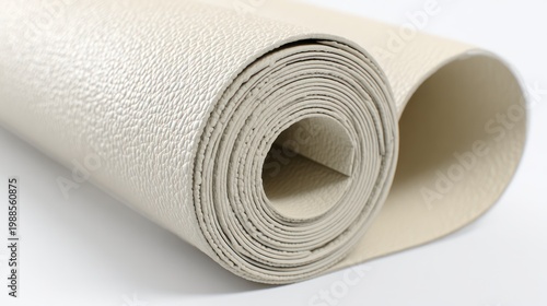 Rolled beige material textured surface and close up view on white background