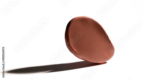 Abstract swatch of brown cosmetic product on white background