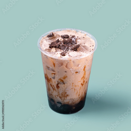 Quadro su tela Refreshing iced coffee drink with chocolate cream and cookie pieces served in pl