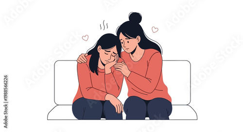 Two women sitting on a couch comforting each other.