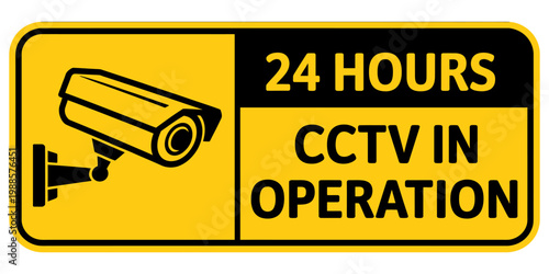 Yellow warning sign indicating twenty four hour CCTV surveillance operation