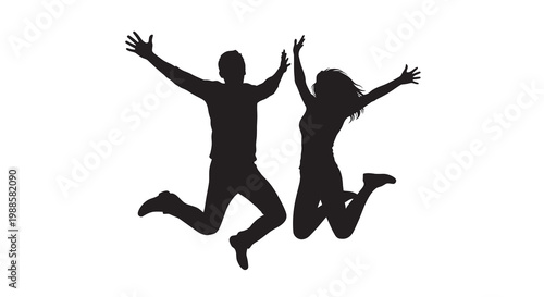 Silhouettes of a couple joyfully jumping in the air with arms raised