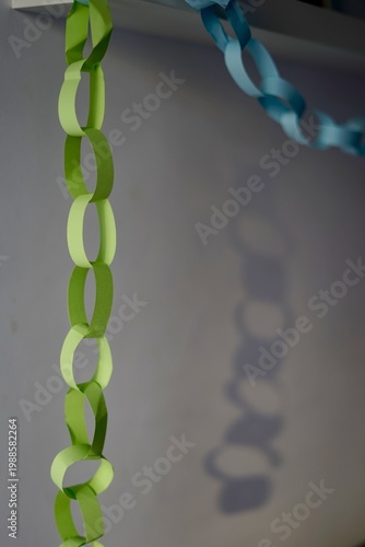 Handmade Wall Hanging Decoration. Crafted Paper Chain Creating Festive Ambiance In Minimal Setting