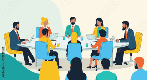 Diverse team collaborates at a round table meeting, using laptops and tablets with drinks