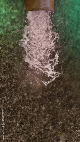 Polluted water draining into the ocean showing severe environmental impact on marine ecosystems