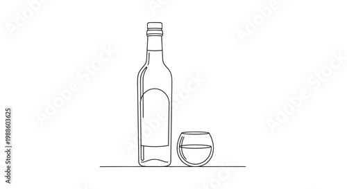 Bottle and glass of whiskey drink.