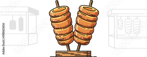 Two golden baked chimney cakes on sticks, displayed at a stall