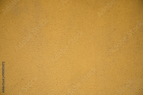 Foto Yellow painted stucco wall texture