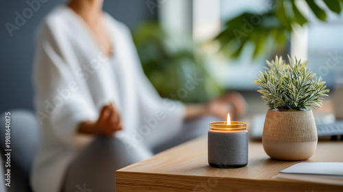 Person meditating in a home office corner with a plant and candle, stress relief and work-life balance self-care concept, defocused background, with copy space