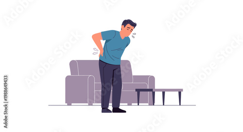Man experiencing sudden lower back pain at his home