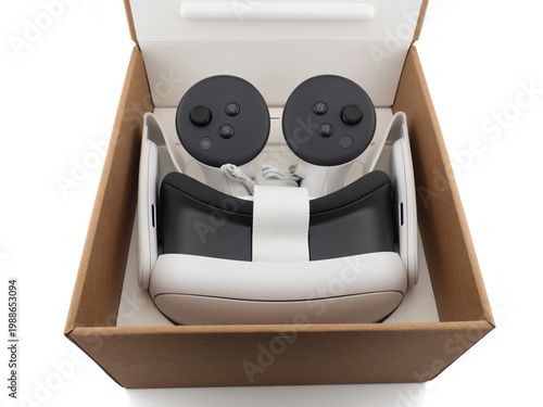Virtual reality headset with controllers in cardboard box unboxing