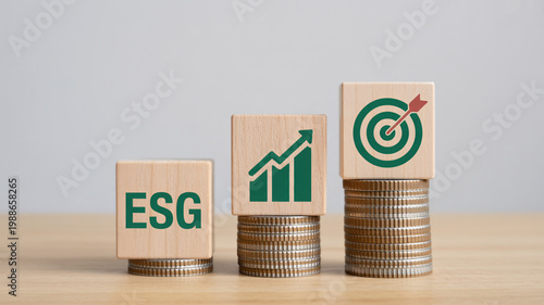 A stack of coins with wooden blocks representing ESG investing growth and targets