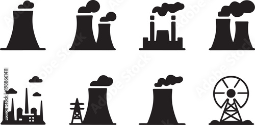 industrial power plant cooling towers emitting steam in factory landscape with transmission towers