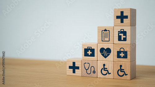 A stack of wooden blocks with medical symbols on a wooden table in a clean room