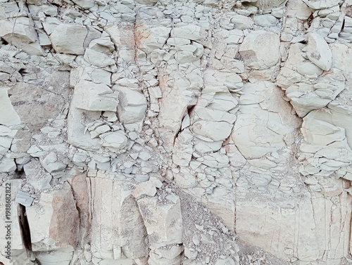 Natural texture of fractured white marl and sedimentary limestone rock.