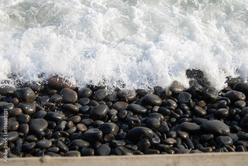 Dark Stone Pebbles at shore