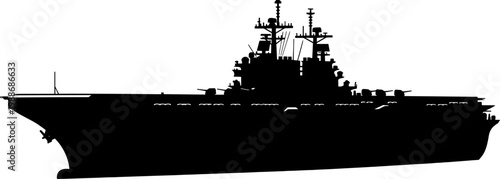 Massive nuclear powered aircraft carrier silhouette on the horizon