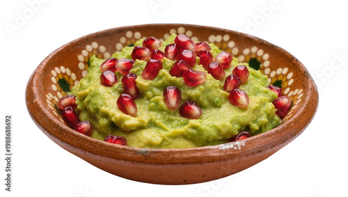 Φωτογραφία Green avocado guacamole with red pomegranate seeds in a decorative clay bowl, is
