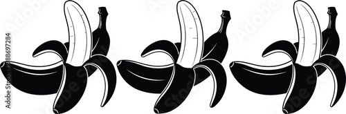 Three black bananas peeled open with white flesh showing.