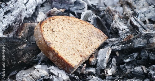pieces of bread are fried on coals