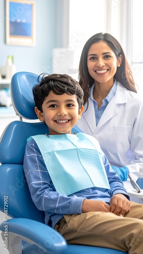 Smiling child at dentist office with assistant.
