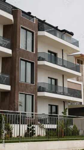 Contemporary residential building with balconies and large windows for perfect city living.
