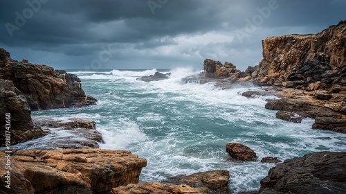 Dramatic coastal scene with immense waves impacting a dark, craggy shoreline.