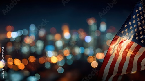 American flag with city lights blurred background at night