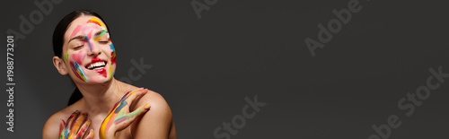 Fotografie Vibrant face art transformation brought to life by a young beautiful woman in an