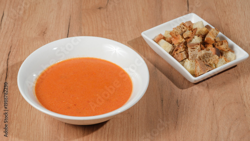 Tomato soup bowl with crackers 