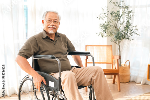 Father's Day Concept, elderly man in wheelchair smiling at home with bright window and plant, calm and supportive senior care scene