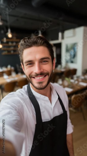 Smiling restaurant worker takes a selfie at a dining area before the evening shift in a modern eatery