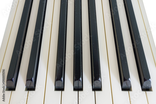 Close-up view of piano keys featuring black and white keys arranged in a linear pattern, showcasing the polished surface and distinct shapes of each key