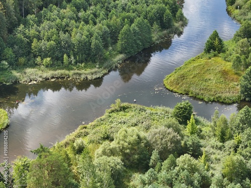 A river's mouth and tributary. One river flows into another. The confluence of two rivers.