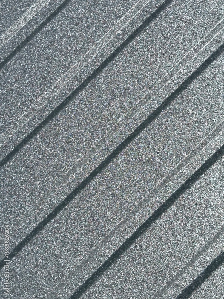 Fototapeta premium Graphite gray corrugated metal sheet for fencing and roofing. Metal profile sheet background