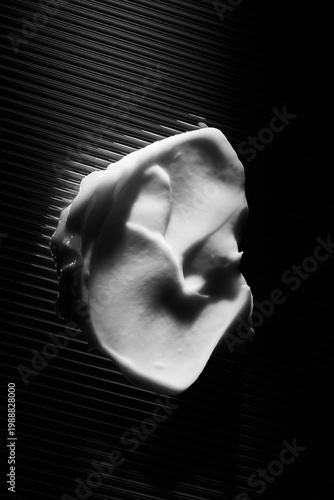 skincare lotion smear over black background