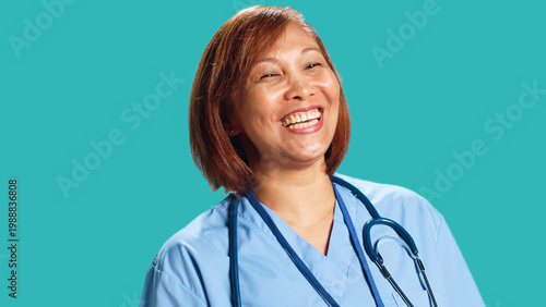 Konstfotografi Upbeat chilled asian clinic worker having burst of laughter while at work