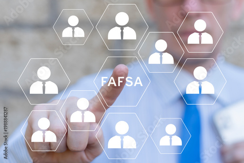 Concept of FAFSA Free Application for Federal Student Aid. Student using virtual touch screen presses the acronym FAFSA.