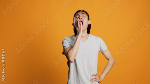 Fotografía Drained person yawning and being tired in studio, falling asleep and feeling worn out