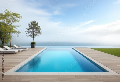 Modern infinity pool overlooking a misty lake