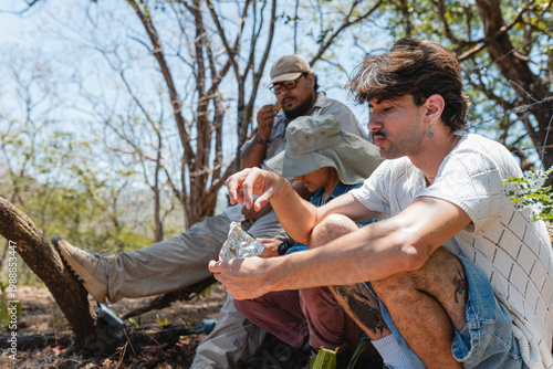 Group of people taking a break during a hiking adventure in nature