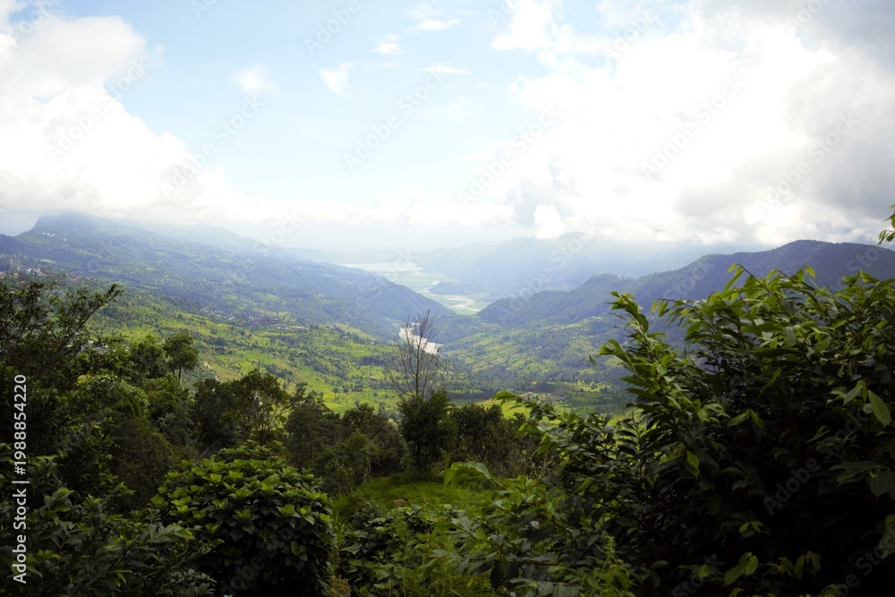 Obraz premium Panoramic green valley landscape in Annapurna region Nepal with mountains and clouds
