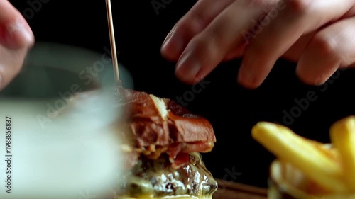 Bearded Man Eating Burger and French Fries Close Up