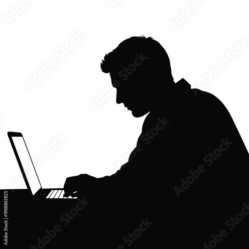 A silhouette of a person typing on a laptop computer in a darkened room.